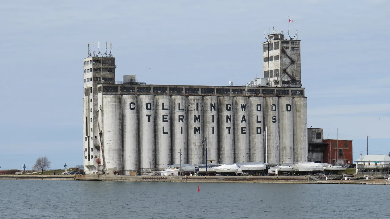 The Collingwood Terminals grain elevator on the harbour, with boats stored along the spit.