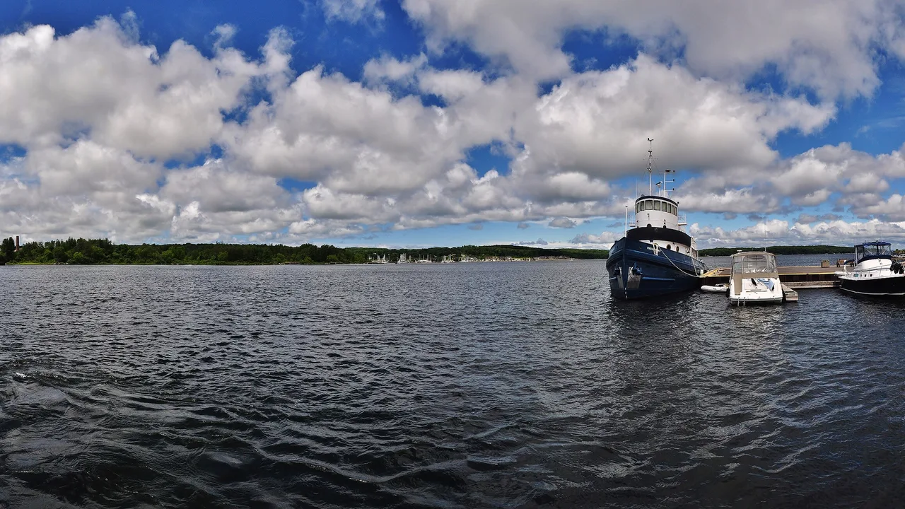 A tugboat and pleasure boats moored in Midland harbour on Georgian Bay, Simcoe County.