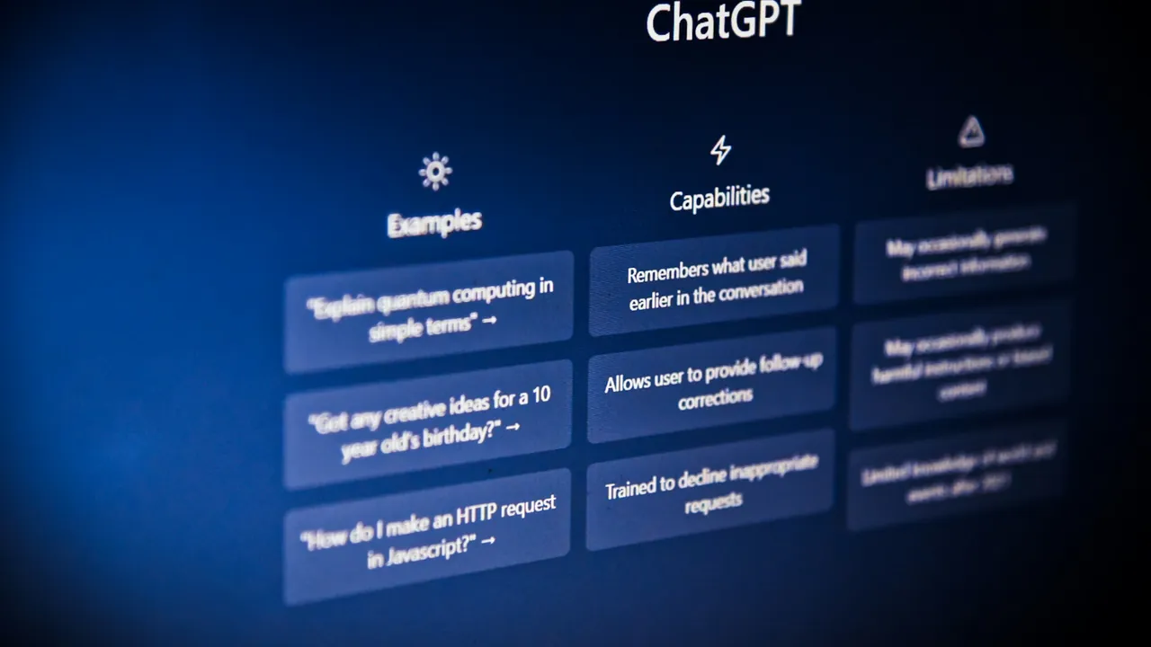 The ChatGPT start screen on a monitor, showing example prompts.
