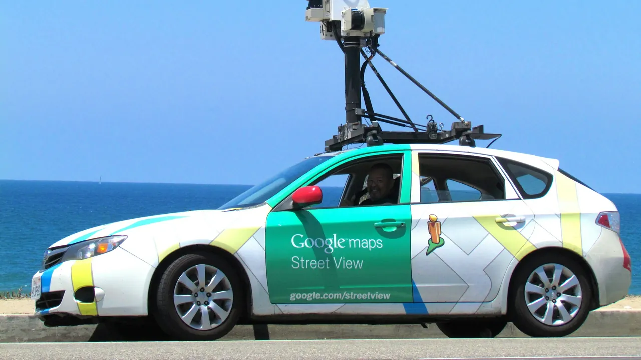 A Google Street View car parked by the water.